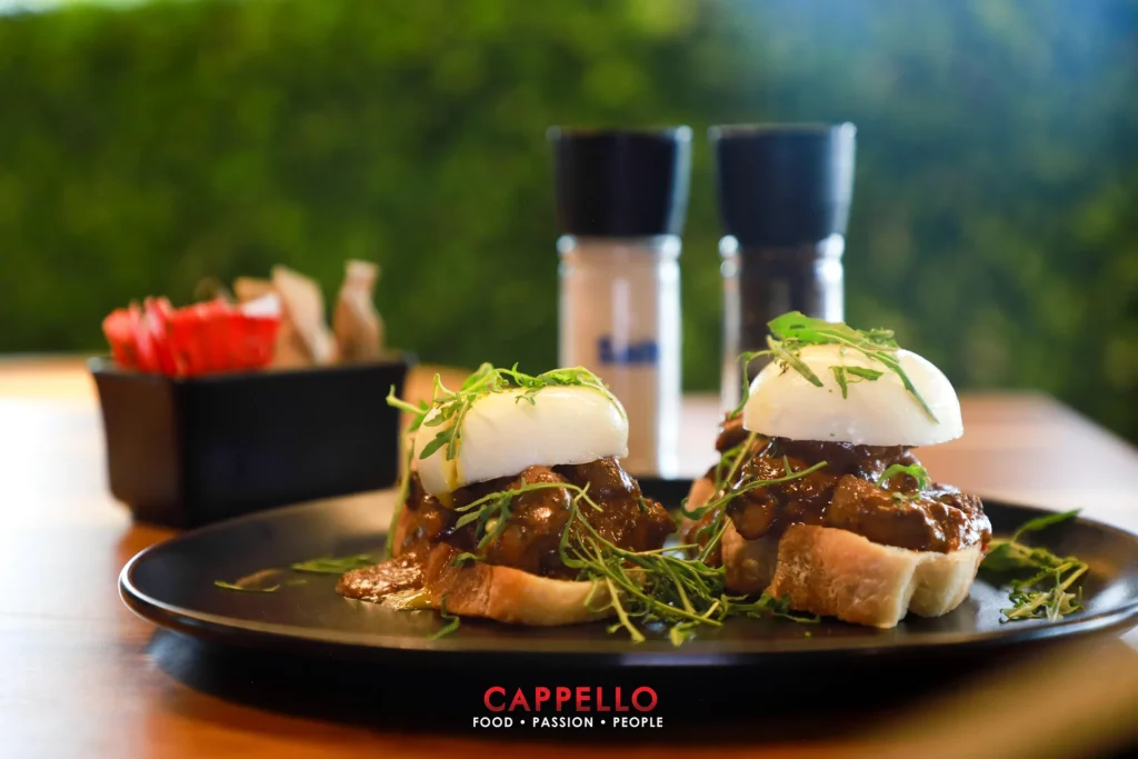 Stacked toasted sandwiches with fries served at Cappello.